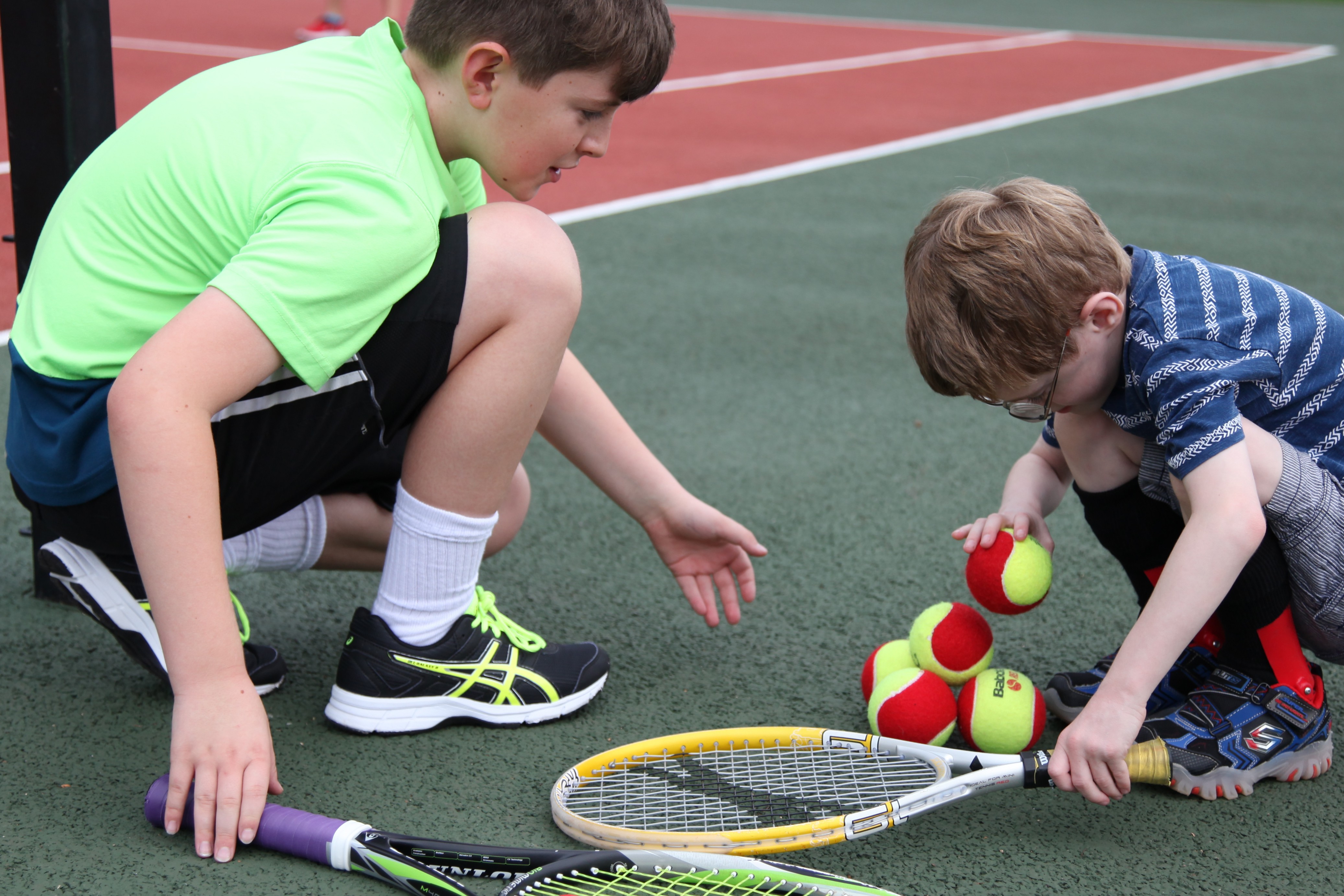 Concentration when stacking mini red tennis balls